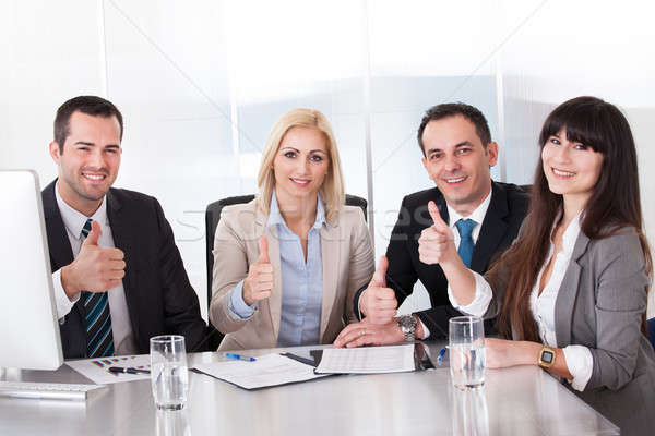 Happy Business Team Showing Thumb Up Sign Stock photo © AndreyPopov