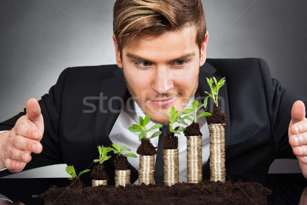 üzletember érmék fiatal felelős üzlet fekete Stock fotó © AndreyPopov