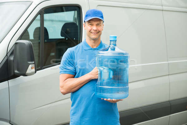 Halten Wasserflasche glücklich LKW Mann Stock foto © AndreyPopov