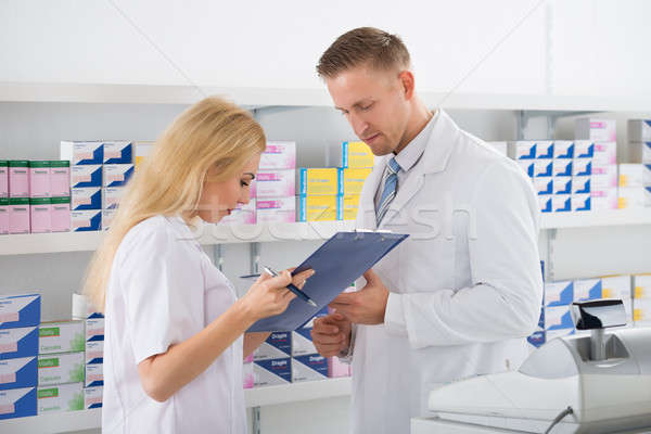 Pharmacists Checking Inventory At Pharmacy Stock photo © AndreyPopov