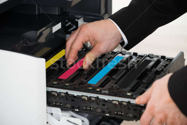 Businessman Fixing Cartridge In Photocopy Machine Stock photo © AndreyPopov