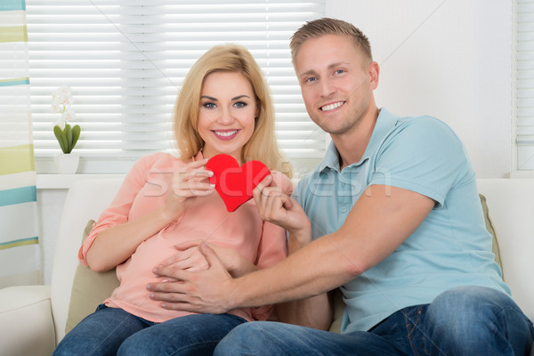Happy Expecting Couple Holding Heart At Home Stock photo © AndreyPopov