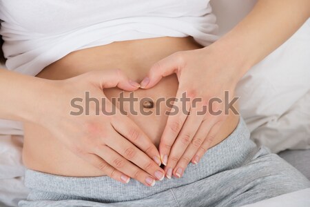 Pregnant Woman Hand On Belly Stock photo © AndreyPopov