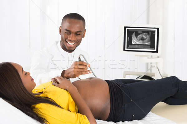 Gynecologist Using Ultrasound On Pregnant Woman's Belly Stock photo © AndreyPopov