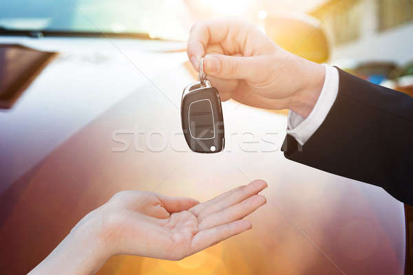 Male Hand Giving Car Key Stock photo © AndreyPopov