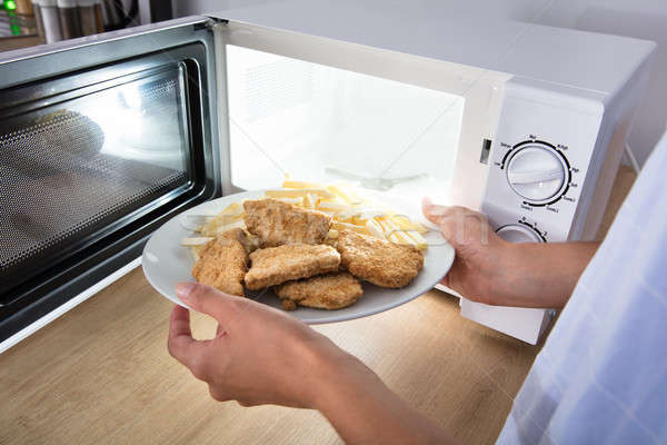 人 加熱 食品 微波 烤箱 商業照片 © AndreyPopov
