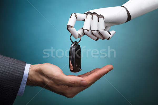 Robot Giving Car Key To Businessperson Stock photo © AndreyPopov