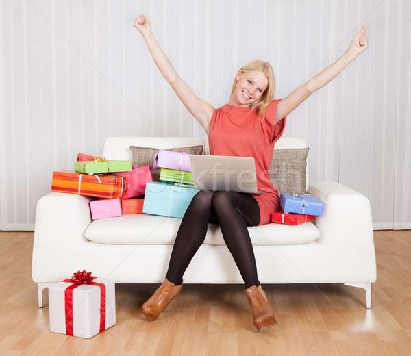 Beautiful young woman buying presents Stock photo © AndreyPopov