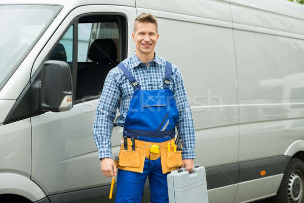 Repairman With Tools And Toolbox In Front Of Van Stock photo © AndreyPopov