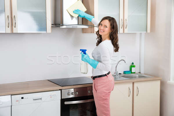 Woman Cleaning Cooker Hood Stock photo © AndreyPopov