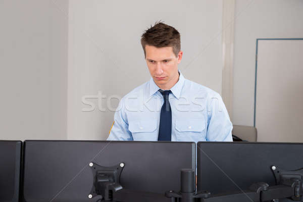 Security Guard Standing In Control Room Stock photo © AndreyPopov