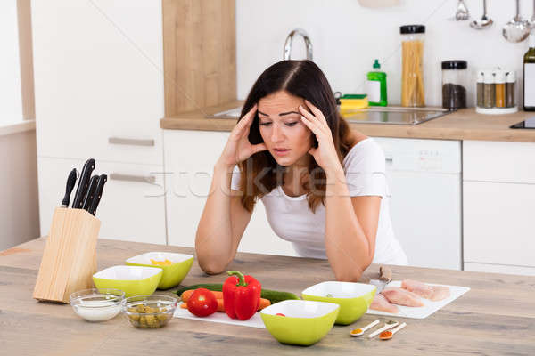 Unhappy Woman In Kitchen Stock photo © AndreyPopov