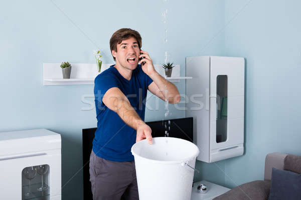 Man roepen loodgieter bezorgd lekkage water Stockfoto © AndreyPopov
