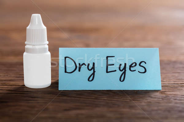 Dry Eyes Concept On Wooden Desk Stock photo © AndreyPopov