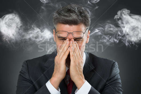Businessman Covering Mouth From Smoke Stock photo © AndreyPopov