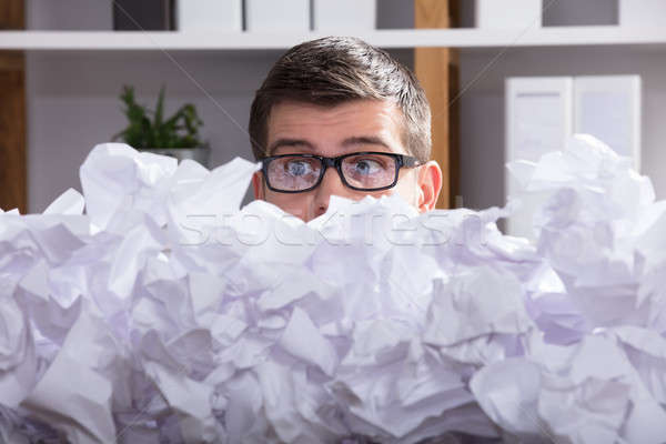 Businessman Looking At Heap Of Crumpled Paper Stock photo © AndreyPopov