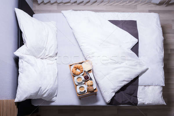 Croissants And Cup Of Tea On Bed Stock photo © AndreyPopov