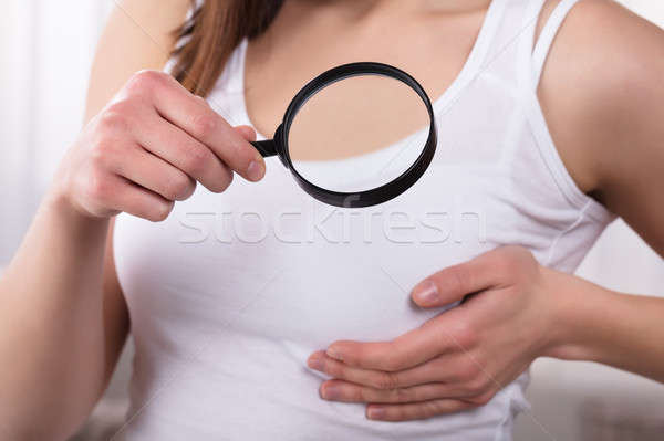 Woman Holding Magnifying Glass Stock photo © AndreyPopov