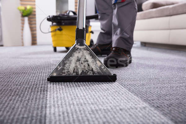 Personne nettoyage tapis aspirateur faible [[stock_photo]] © AndreyPopov