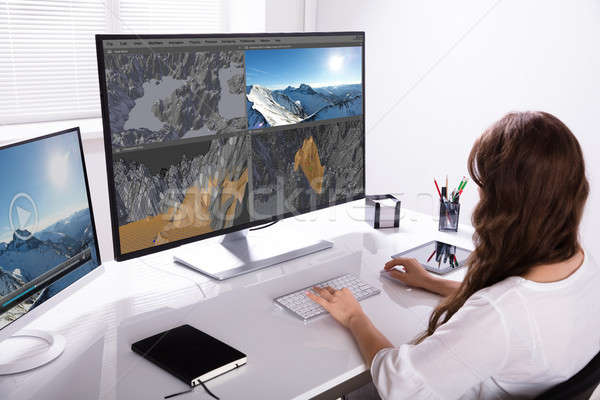 Woman Rendering 3D Landscape On Computer Stock photo © AndreyPopov