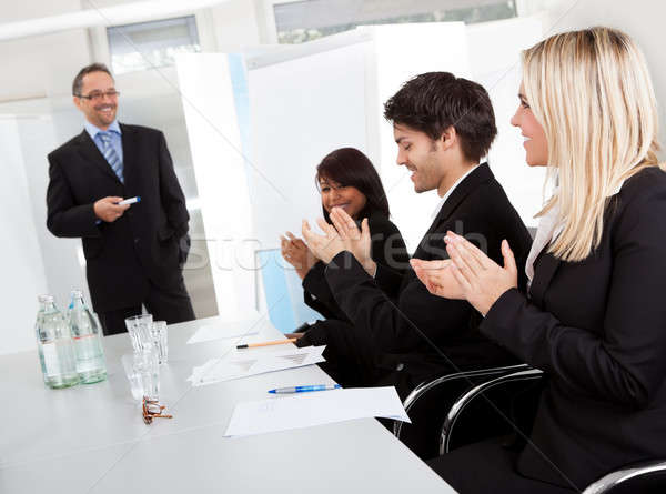 Business people at presentation applauding Stock photo © AndreyPopov