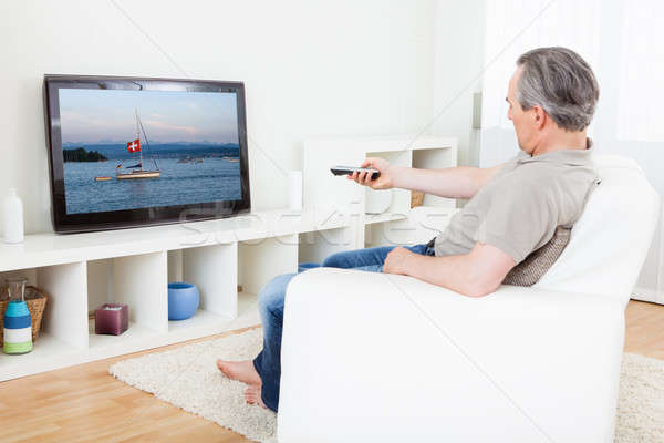 Olgun adam izlerken tv portre ev film Stok fotoğraf © AndreyPopov
