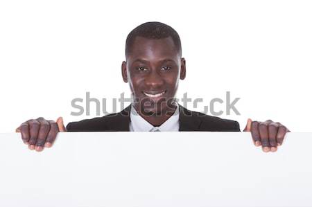 African Man With White Board Stock photo © AndreyPopov