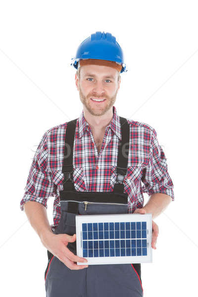 Confident Repairman Holding Solar Panel Stock photo © AndreyPopov