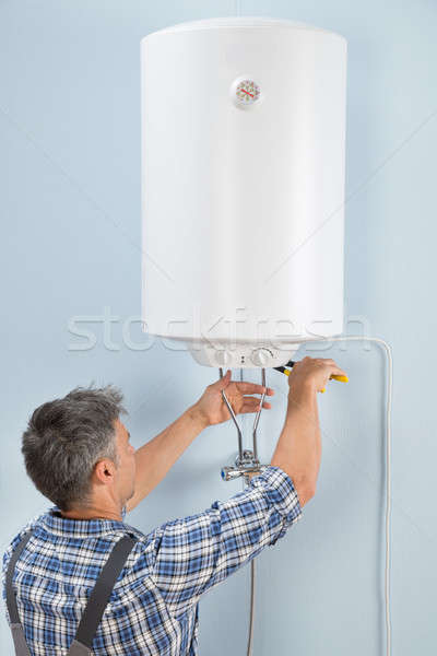 Férfi vízvezetékszerelő javít elektromos portré boldog Stock fotó © AndreyPopov