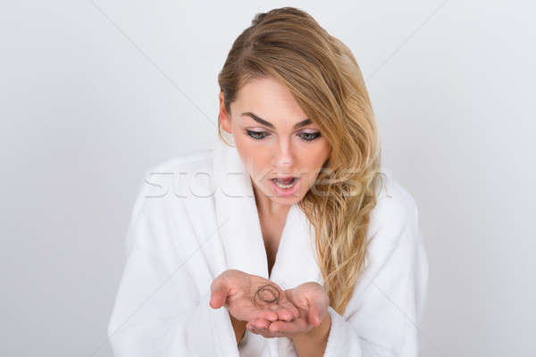 Worried Woman Holding Loss Hair Stock photo © AndreyPopov