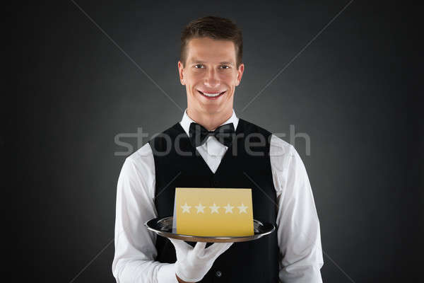 Waiter With Star Rating Board Stock photo © AndreyPopov