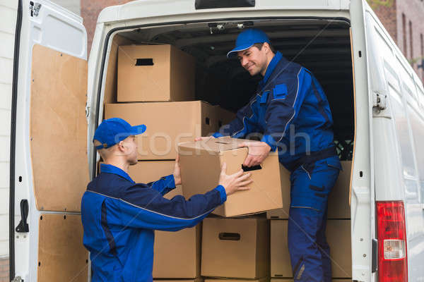 Delivery Men Unloading Boxes From Truck Stock photo © AndreyPopov