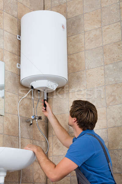 Technician Repairing Electric Boiler Stock photo © AndreyPopov