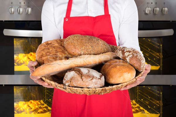 Person Hand Holding Plate Full Of Breads And Buns Stock photo © AndreyPopov