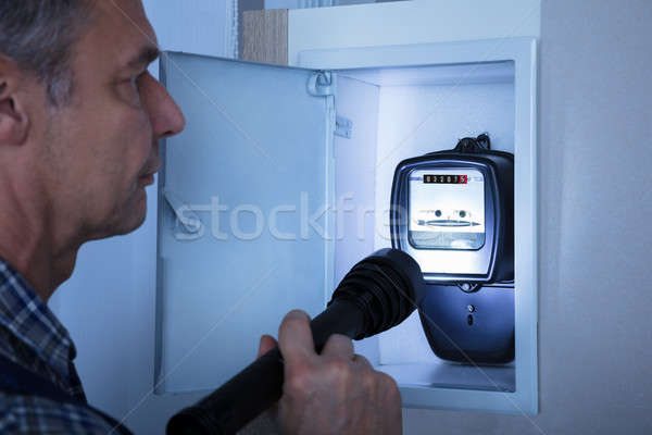 Electrician Examining A Electricity Meter Stock photo © AndreyPopov