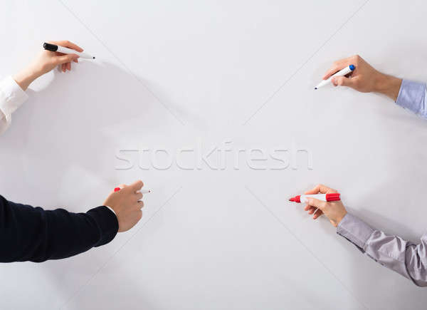 Hands Writing With Marker On Whiteboard Stock photo © AndreyPopov