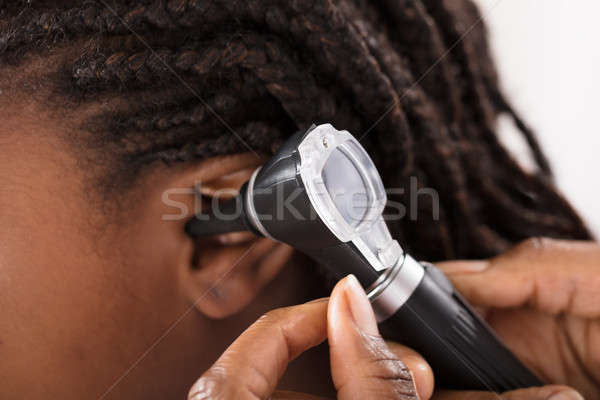 Doctor Checking Girl Ear In Hospital Stock photo © AndreyPopov