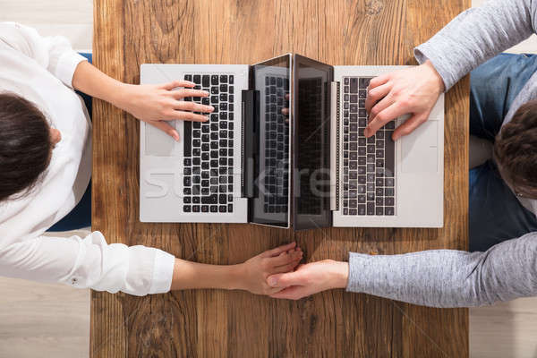 Overhead View Of Couple Using Laptop Stock photo © AndreyPopov