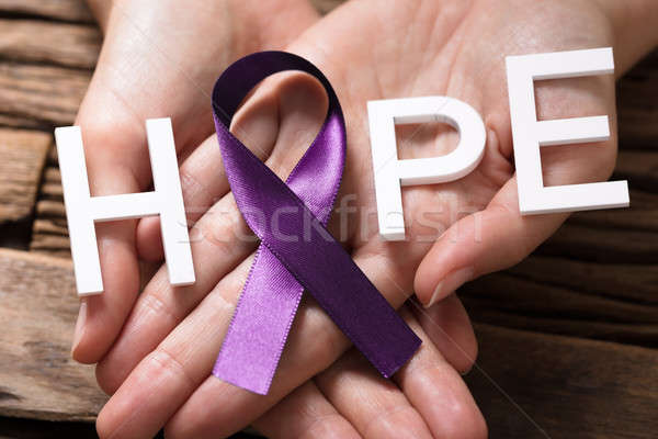 Hand Showing Ribbon With Hope Text Stock photo © AndreyPopov