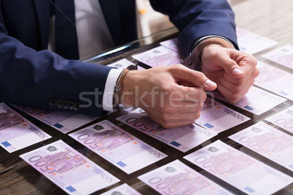 üzletember bilincs letartóztatva közelkép kéz bilincs Stock fotó © AndreyPopov