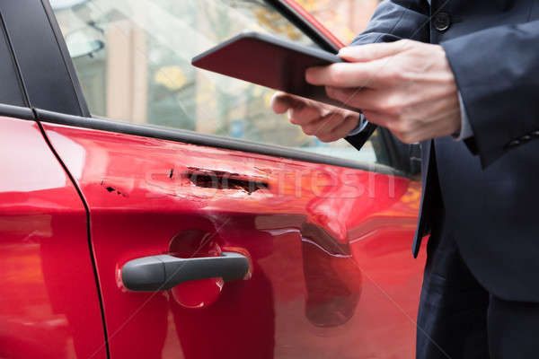 Human Hand Holding Digital Tablet Near Car Stock photo © AndreyPopov