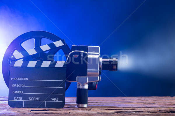 Filmkamera Filmrolle Bord beleuchtet Holz Stock foto © AndreyPopov