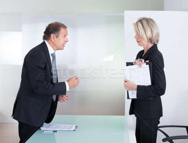 Stock photo: Mature Businessman And Businesswoman Fighting