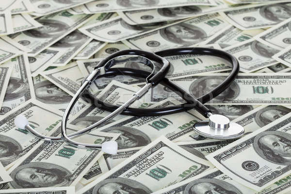 Stethoscope and american dollars Stock photo © AndreyPopov