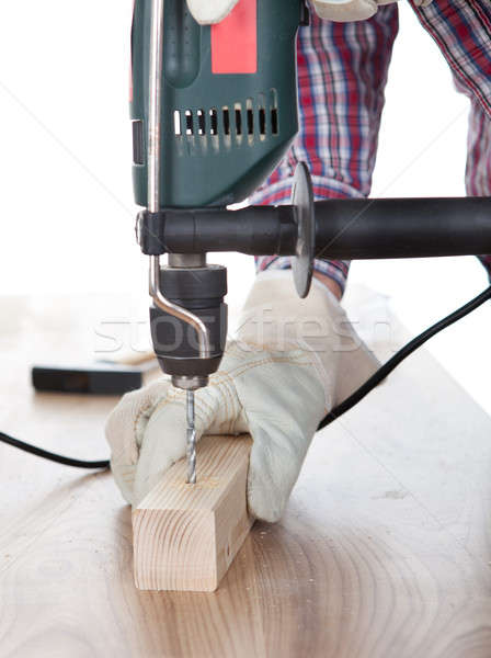 Werknemer boren gat hout elektrische boor Stockfoto © AndreyPopov