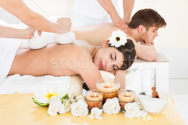 Couple Receiving Back Massage In Spa Stock photo © AndreyPopov