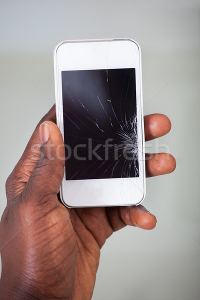 Homme d'affaires smartphone fissuré écran main Photo stock © AndreyPopov