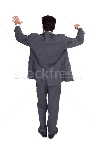 Stock photo: Businessman Directing With A Conductor's Baton