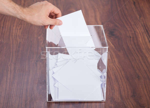 Person Putting Ballot In Box Stock photo © AndreyPopov