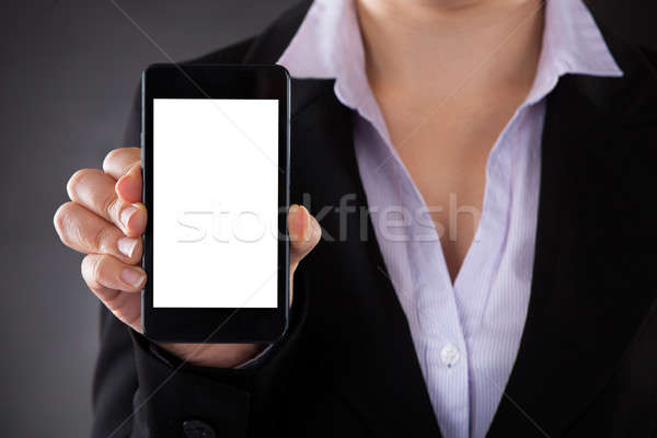 Businessperson Showing Mobile Phone Stock photo © AndreyPopov